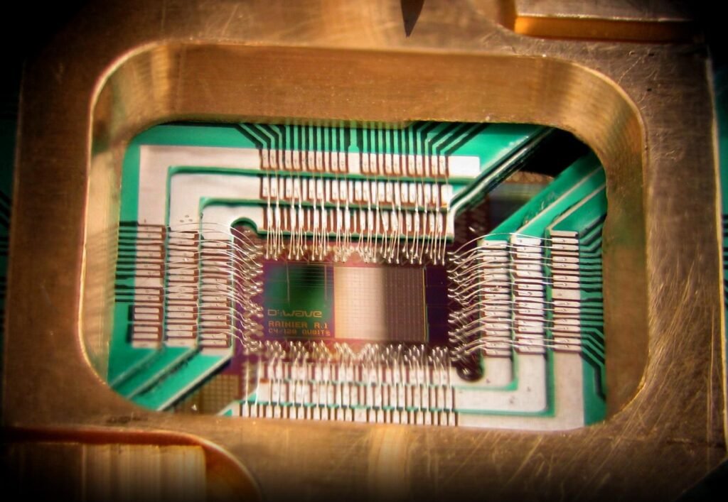 Close up photograph of a 128 qubit superconducting quantum processor chip mounted in its holder