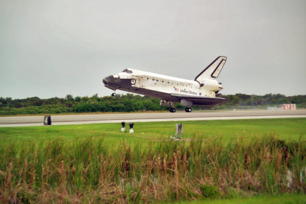 Space Shuttle Discovery gliding down to landing, an early example of partial launch vehicle reusability