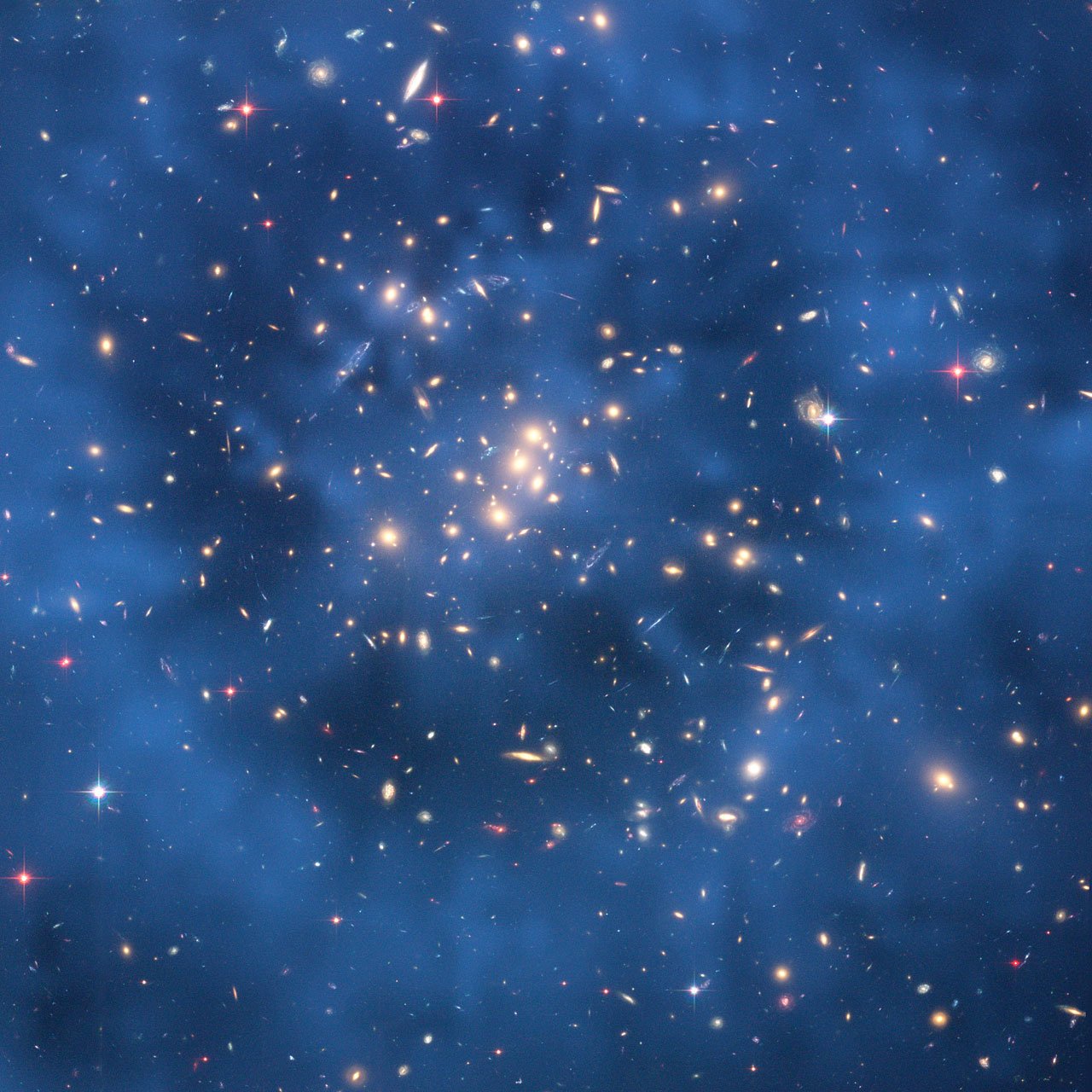 Hubble image of galaxy cluster Cl 0024+17 with a blue ring showing the location of dark matter