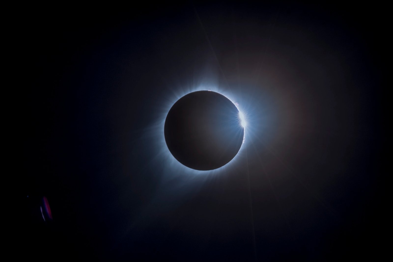 The Sun's corona visible as a pearly white halo surrounding the eclipsed Moon during the 2017 total solar eclipse